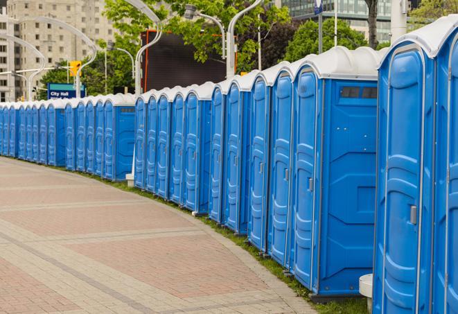 a row of portable restrooms at a fairground, offering visitors a clean and hassle-free experience in verdi